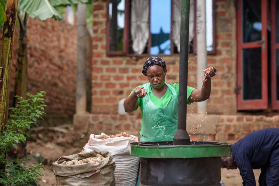A Gracela Ventures team member working with biomass material